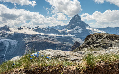 Scenic view of snowcapped mountains against sky