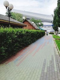 Street amidst buildings against sky