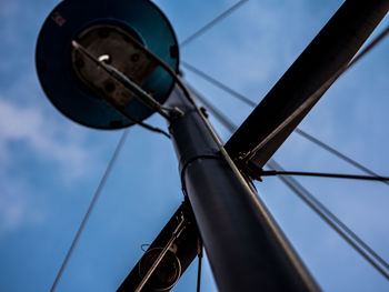 Low angle view of telephone pole against sky