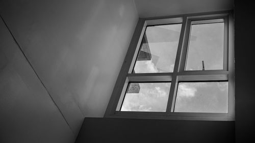 Low angle view of sky seen through window