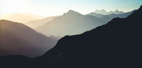 Scenic view of silhouette mountains against sky