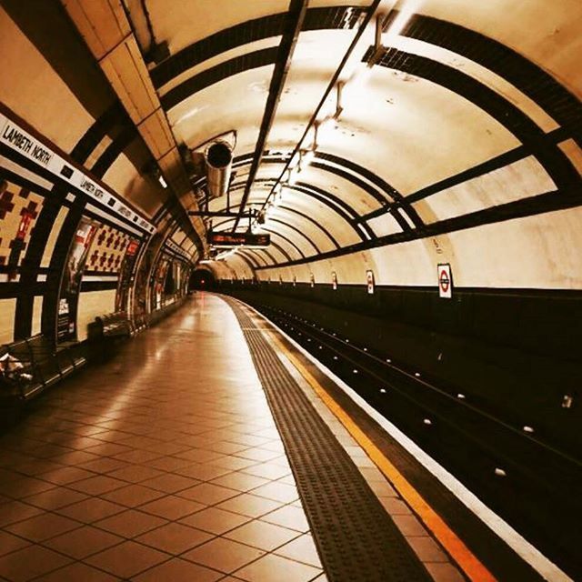 indoors, railroad track, rail transportation, transportation, railroad station, public transportation, railroad station platform, ceiling, the way forward, illuminated, diminishing perspective, architecture, built structure, subway station, vanishing point, subway, tunnel, empty, travel, transportation building - type of building