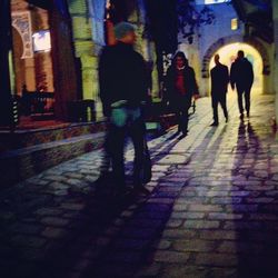 People walking in tunnel