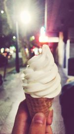 Close-up of hand holding ice cream cone