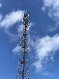 Low angle view of communications tower against sky