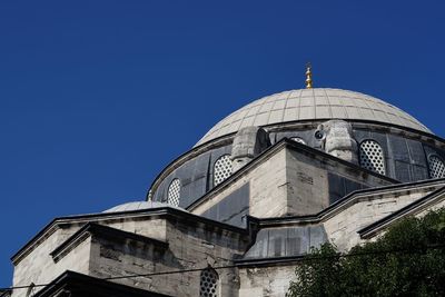 Low angle view of built structure against clear blue sky