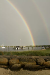 Scenic view of rainbow over sea