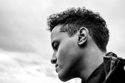 Close-up of young man against sky