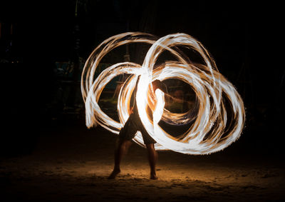 Fire dancer performing at night