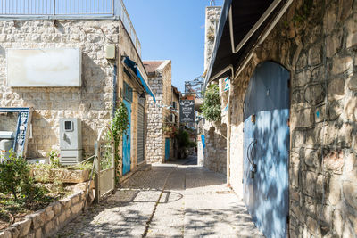 Narrow alley amidst buildings in town