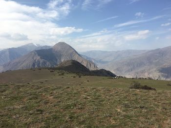 Scenic view of landscape and mountains against sky