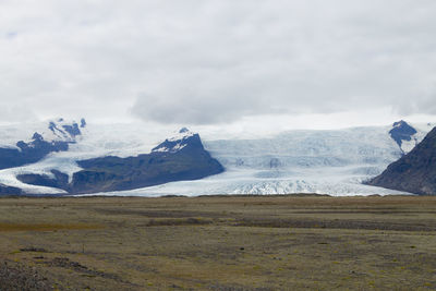 Scenic view of glacier against sky