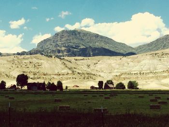 Scenic view of landscape against cloudy sky