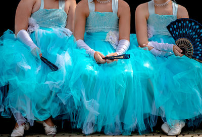 Low section of girls wearing dress
