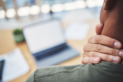 Midsection of woman using laptop