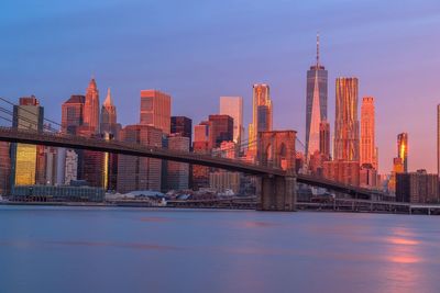 View of suspension bridge with city in background