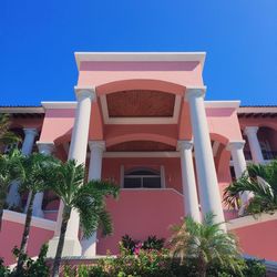 Low angle view of building against clear blue sky