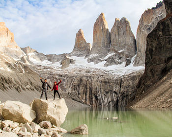 Rear view of man walking on rock