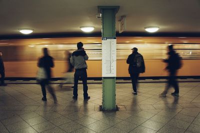 People standing at railroad station