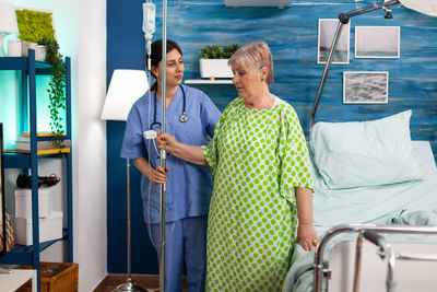 Nurse helping patient at hospital