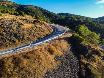 Winding mountain road in madrid, aerial drone view