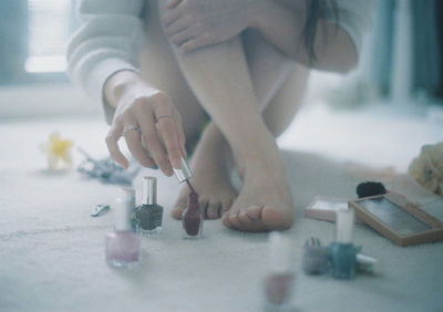 Close-up of woman playing with ball on table