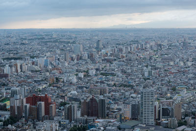 Aerial view of city buildings against sky