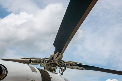 Low angle view of airplane against sky