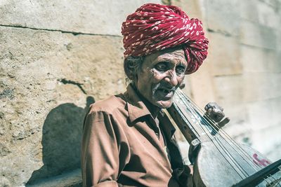 Close-up of man playing guitar