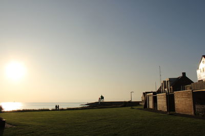 Scenic view of sea against clear sky during sunset