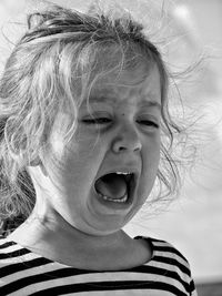 Close-up of crying girl shouting
