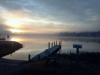 Empty bench at sunset