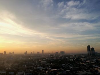 Cityscape against sky during sunset