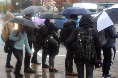 Group of people on wet rainy day