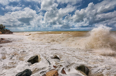 Scenic view of beach against sky