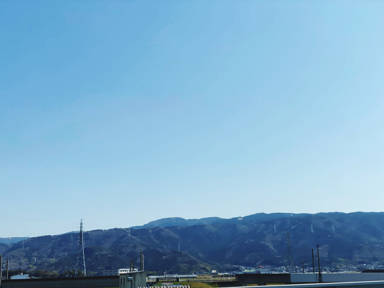 VIEW OF MOUNTAINS AGAINST CLEAR BLUE SKY