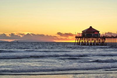 Scenic view of beach against sky during sunset