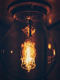 Low angle view of illuminated light bulb