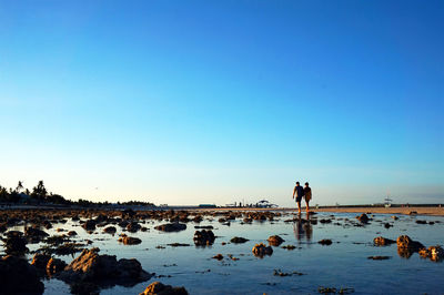 Scenic view of calm sea against clear sky