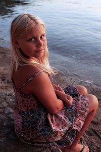 Portrait of girl sitting at beach