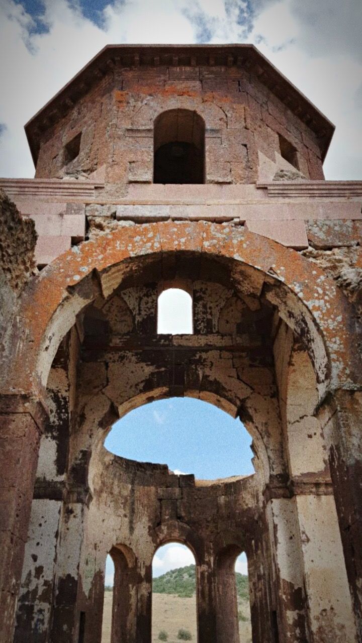 arch, architecture, built structure, history, low angle view, old, arched, building exterior, sky, tower, old ruin, travel destinations, the past, ruined, deterioration, obsolete, outdoors, day, stone material, tourism, archway, tall, ancient, ancient civilization, famous place, tall - high, medieval, no people, facade