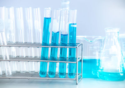 Close-up of blue chemical in container at laboratory