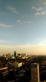 High angle view of buildings in city against sky