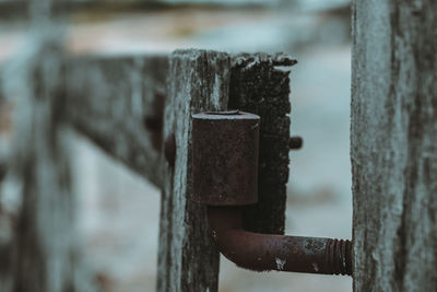 Close-up of old wooden post