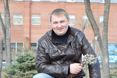 Portrait of man sitting outdoors