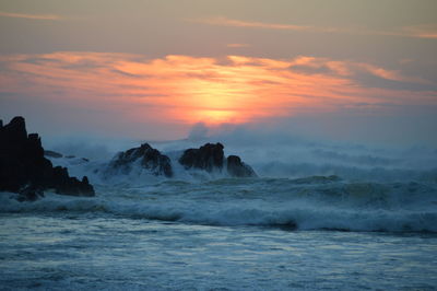 Scenic view of sea against sky during sunset