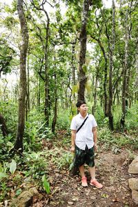 Full length of young man in forest