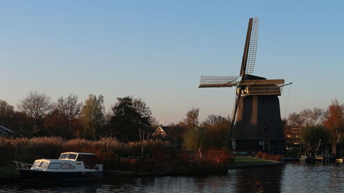 Ship in lake against clear sky