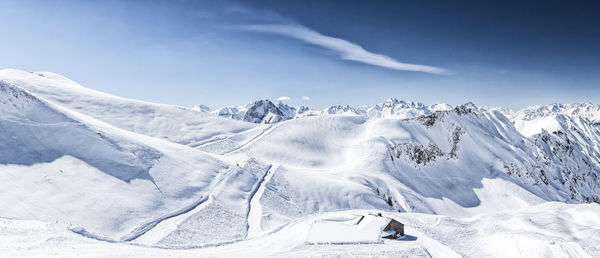 Scenic view of snow covered mountain against sky