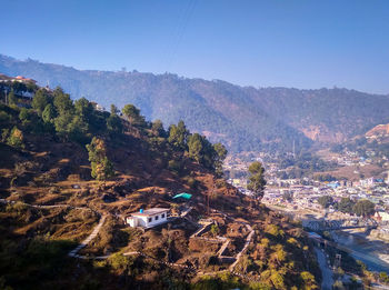 High angle view of townscape against mountains